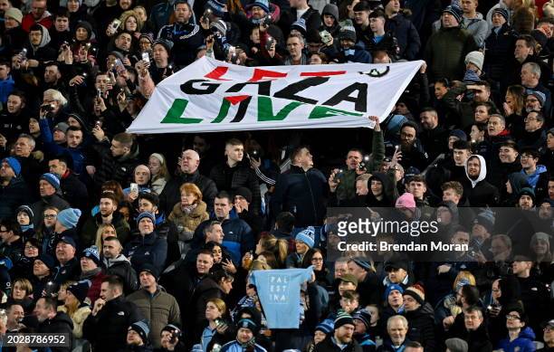 Dublin , Ireland - 24 February 2024; Supporters hold up a sign and use the torch on their phones to shine a light for hope during 'Light Up Croke...