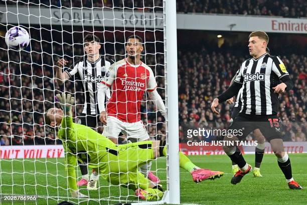 Newcastle United's German goalkeeper Loris Karius is unable to prevent a header from Arsenal's Polish defender Jakub Kiwior making it 4-0 during the...