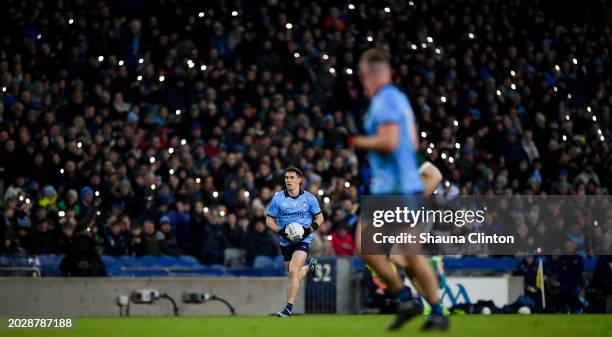 Dublin , Ireland - 24 February 2024; Lee Gannon of Dublin runs up the field as supporters use the torch on their phones to shine a light for hope...