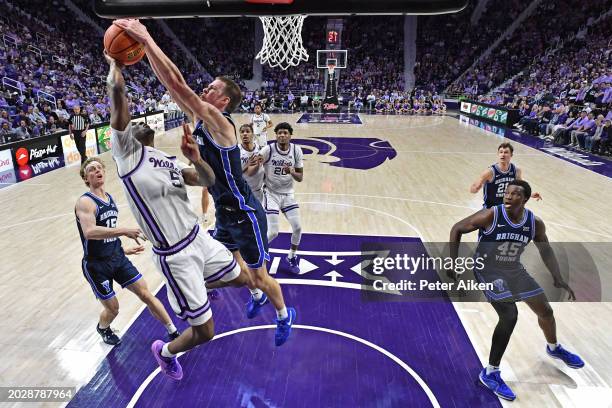 Noah Waterman of the Brigham Young Cougars blocks the shot of Cam Carter of the Kansas State Wildcats in the first half at Bramlage Coliseum on...