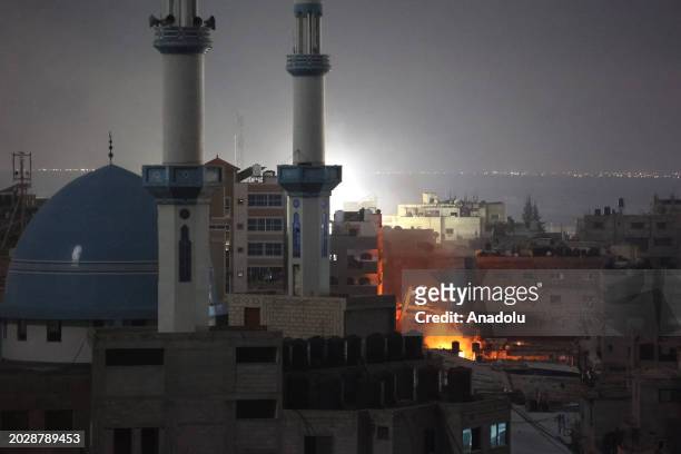 Flames rise after Israeli forces attack a building in Rafah, Gaza on February 24, 2024.
