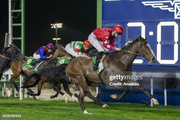 Oisin Orr wins the 'G2 Howden Neom Turf' trophy over 2100 meters with his horse 'Spirit Dancer' during the Saudi Cup, the world's most expensive...