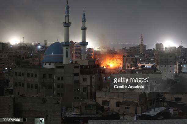 Flames rise after Israeli forces attack a building in Rafah, Gaza on February 24, 2024.