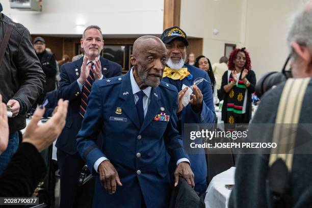 Brigadier General Enoch "Woody" Woodhouse one of the last surviving Tuskegee Airman, makes his way to the stage to receive the Legacy Award during...