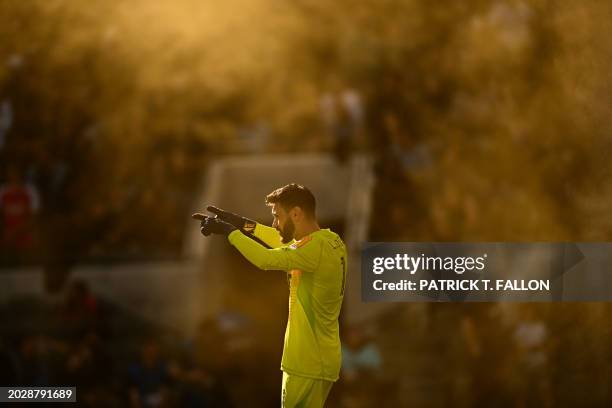 Smoke from fans surrounds Los Angeles FC goalkeeper Hugo Lloris during the MLS football match between the Los Angeles FC and Seattle Sounders at BMO...