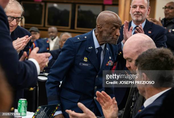 Brigadier General Enoch "Woody" Woodhouse one of the last surviving Tuskegee Airman, makes his way to the stage to receive the Legacy Award during...