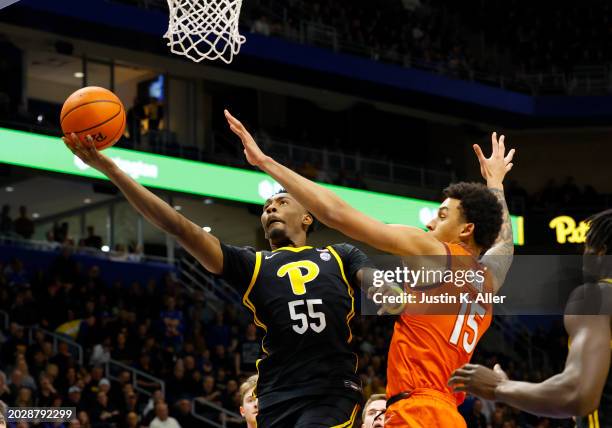 Zack Austin of the Pittsburgh Panthers lays on in against Lynn Kidd of the Virginia Tech Hokies in the second half at Petersen Events Center on...