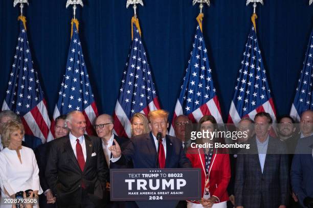 Former US President Donald Trump, center, speaks during an election night watch party at the South Carolina State Fairgrounds in Columbia, South...