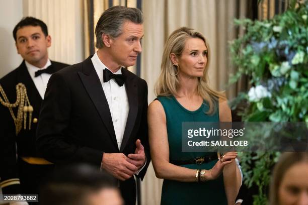California Governor Gavin Newsom and his wife, Jennifer Siebel Newsom, attend a black-tie dinner for US governors and their spouses following the...
