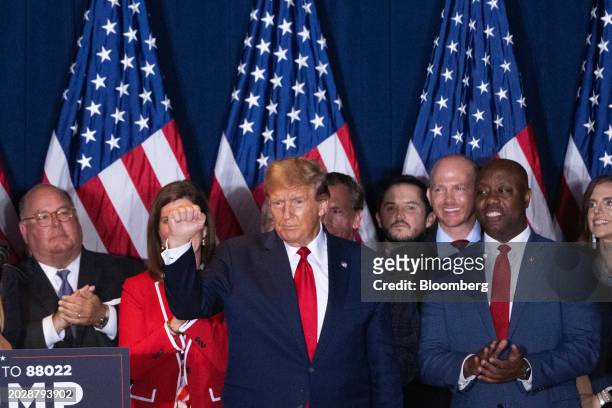Former US President Donald Trump, center, and Senator Tim Scott, a Republican from South Carolina, right, during an election night watch party at the...