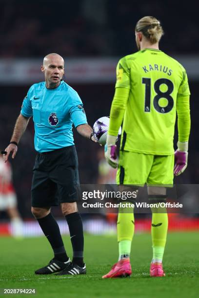 Referee Paul Tierney hands the ball to Newcastle United goalkeeper Loris Karius during the Premier League match between Arsenal FC and Newcastle...