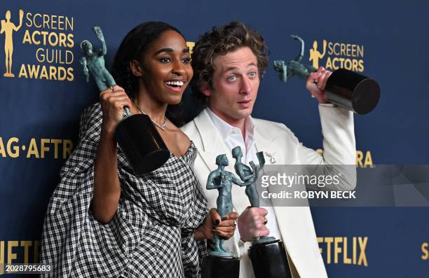 Actress Ayo Edebiri and US actor Jeremy Allen White pose in the press room with the awards for Outstanding Performance by a Female and Male Actor in...