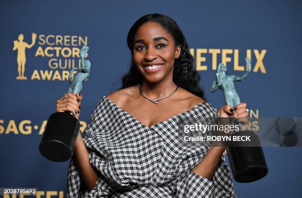 Actress Ayo Edebiri poses in the press room with the awards for Outstanding Performance by a Female Actor in a Comedy Series and Outstanding...