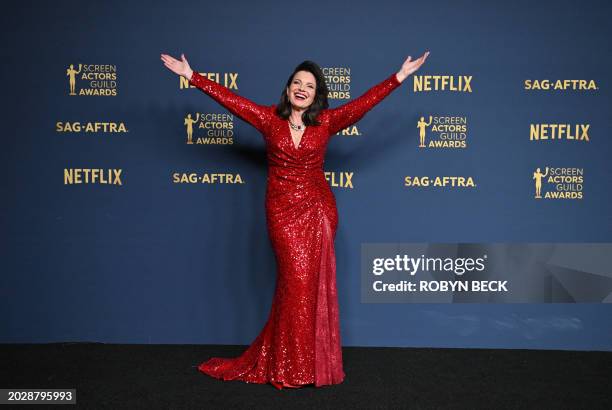 President actress Fran Drescher poses in the press room during the 30th Annual Screen Actors Guild awards at the Shrine Auditorium in Los Angeles,...