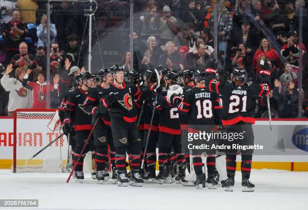 Members of the Ottawa Senators celebrate their 4-3 shootout win against the Vegas Golden Knights at Canadian Tire Centre on February 24, 2024 in...