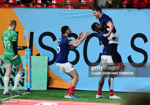 France's Antoine Dupont is lifted by a team mate after he scores a try against Ireland to win the game during HSBC SVNS Vancouver tournament in...