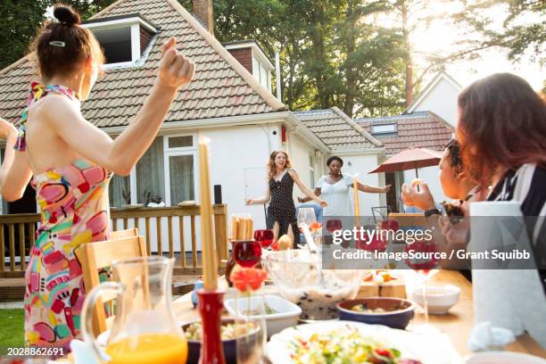 women dancing and having fun outside at a summer garden party - garden brunch stock pictures, royalty-free photos & images