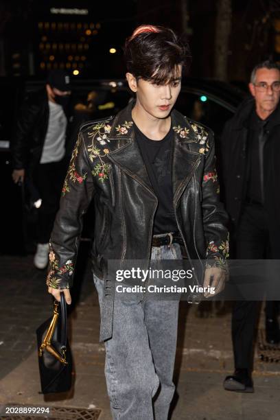 Ren Jialun aka Allen Ren wears black leather jacket, denim jeans, bag outside Etro during the Milan Fashion Week - Womenswear Fall/Winter 2024-2025...