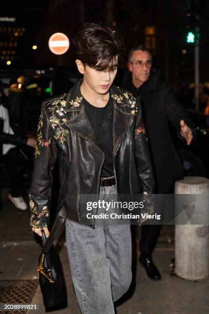 Ren Jialun aka Allen Ren wears black leather jacket, denim jeans, bag outside Etro during the Milan Fashion Week - Womenswear Fall/Winter 2024-2025...