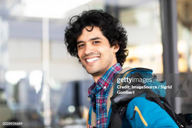 young man outside with bag - messestand bildbanksfoton och bilder