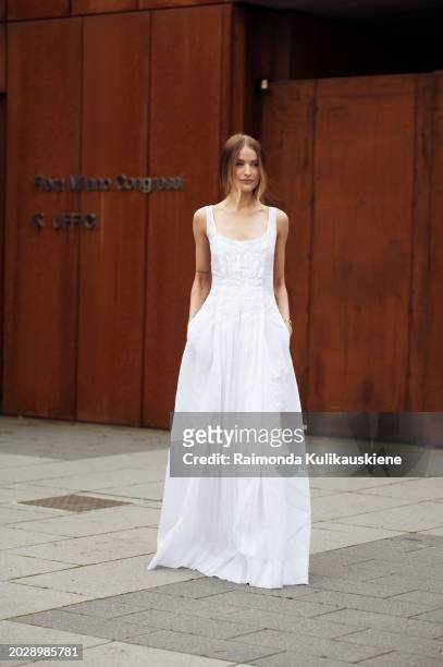 Victoria Magrath wears a white long sleeveless dress outside Alberta Ferretti during the Milan Fashion Week - Womenswear Fall/Winter 2024-2025 on...