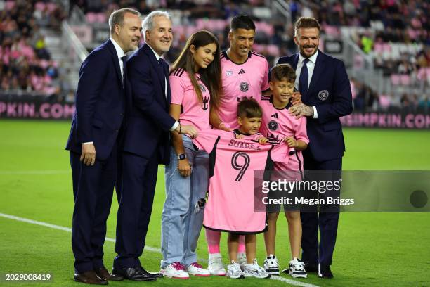Inter Miami co-owners Jorge Mas and former English footballer David Beckham welcome Luis Suarez of Inter Miami to the team ahead of the first half...