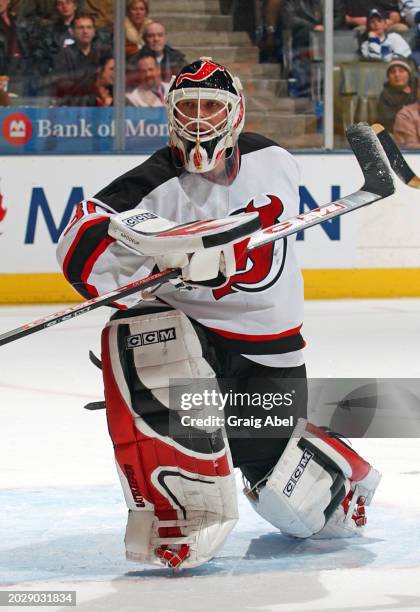 Martin Brodeur of the Carolina Hurricanes skates against the Toronto Maple Leafs during NHL game action on February 28, 2004 at Air Canada Centre in...