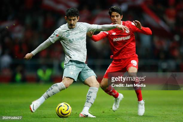 Jesus Ocejo of Santos fights for the ball with Carlos Orrantia of Toluca during the 9th round match between Toluca and Santos Laguna as part of...