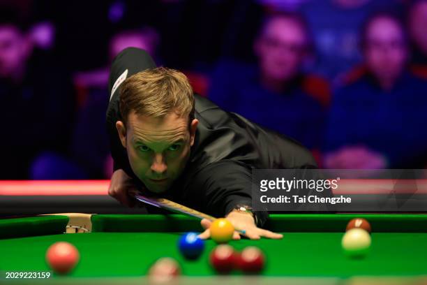 Ali Carter of England plays a shot in the Quarter-final match against Judd Trump of England on day three of 2024 Players Championship at Telford...