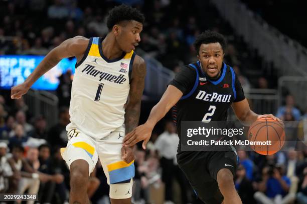 Chico Carter Jr. #2 of the DePaul Blue Demons drives against Kam Jones of the Marquette Golden Eagles during the second half at Fiserv Forum on...
