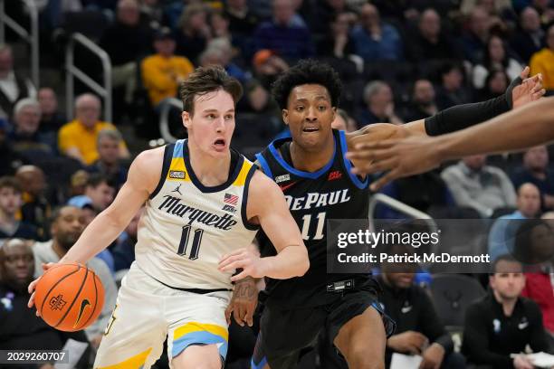 Tyler Kolek of the Marquette Golden Eagles drives against Keyondre Young of the DePaul Blue Demons during the first half at Fiserv Forum on February...