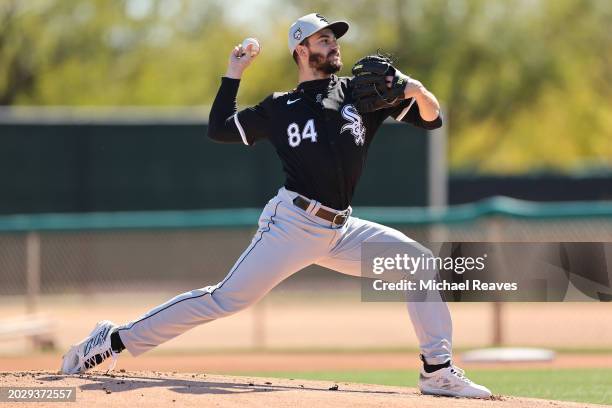 Dylan Cease of the Chicago White Sox delivers a pitch during a live batting practice session during a spring training workout at Camelback Ranch on...