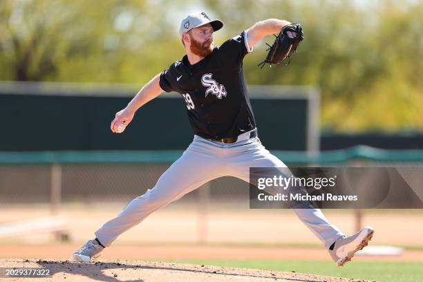 John Brebbia of the Chicago White Sox delivers a pitch during a live batting practice session during a spring training workout at Camelback Ranch on...