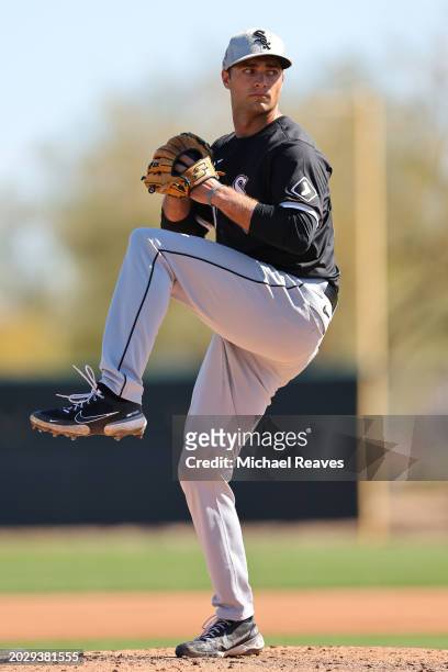 Nick Nastrini of the Chicago White Sox delivers a pitch during a live batting practice sessionduring a spring training workout at Camelback Ranch on...
