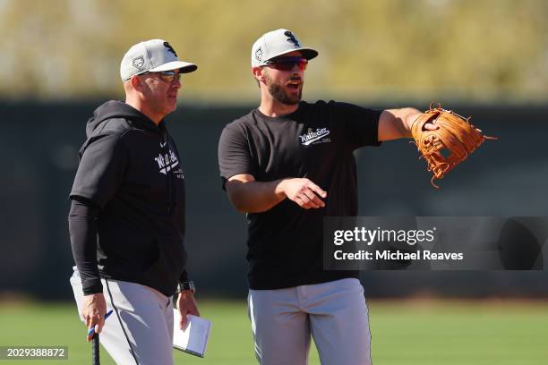 Manager Pedro Grifol of the Chicago White Sox talks with Paul DeJong during a spring training workout at Camelback Ranch on February 21, 2024 in...