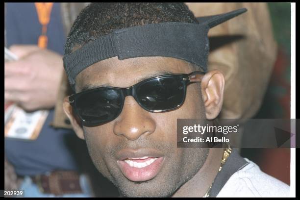 Defensive back Deion Sanders of the Dallas Cowboys talks to the press at the Buttes Hotel before Super Bowl XXX against the Pittsburgh Steelers at...