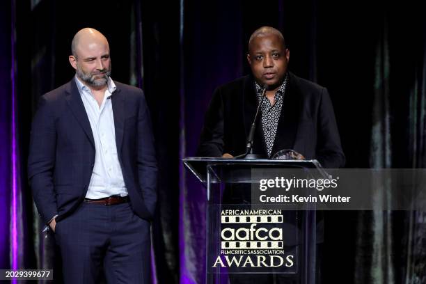 Joaquim Dos Santos and Kemp Powers accept the Best Animated Feature Award for "Spider-Man: Across the Spider-Verse" onstage during the 15th Annual...