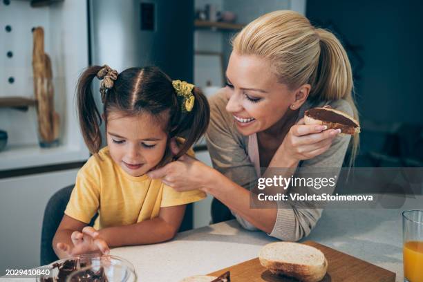 happy family having breakfast. - mothers day chocolates stock pictures, royalty-free photos & images