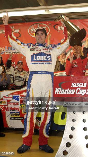 Jimmie Johnson, driver of the Lowes Chevrolet Monte Carlo, celebrates after winning the Coca-Cola 600 on May 25, 2003 at Lowe's Motor Speedway in...