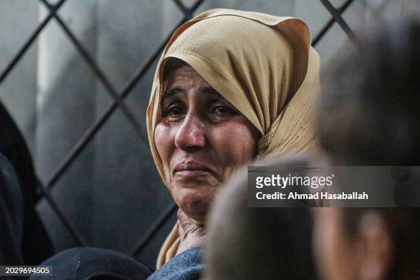 People mourn as they receive the dead bodies of victims of an Israeli strike on February 22, 2024 in Rafah, Gaza. Strikes intensified as Israel...