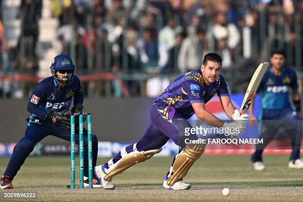 Quetta Gladiators' Rilee Rossouw plays a shot during the Pakistan Super League Twenty20 cricket match between Multan Sultans and Quetta Gladiators at...