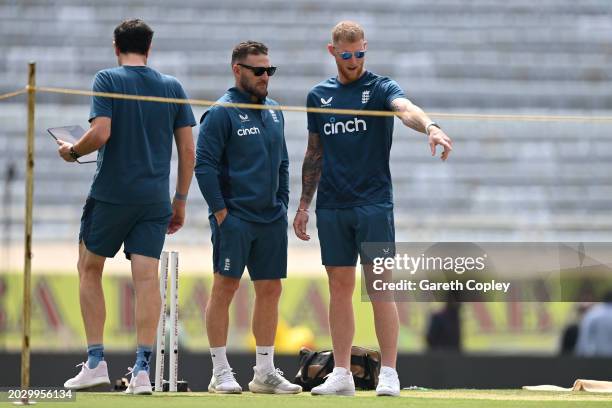 England captain Ben Stokes and coach Brendon McCullum look at the pitch during a nets session at JSCA International Stadium Complex on February 22,...