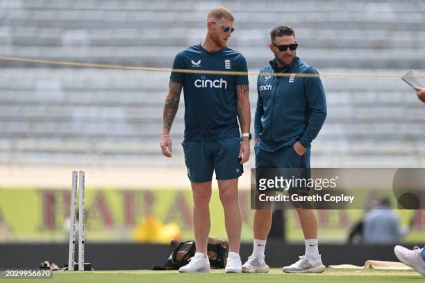 England captain Ben Stokes and coach Brendon McCullum look at the pitch during a nets session at JSCA International Stadium Complex on February 22,...