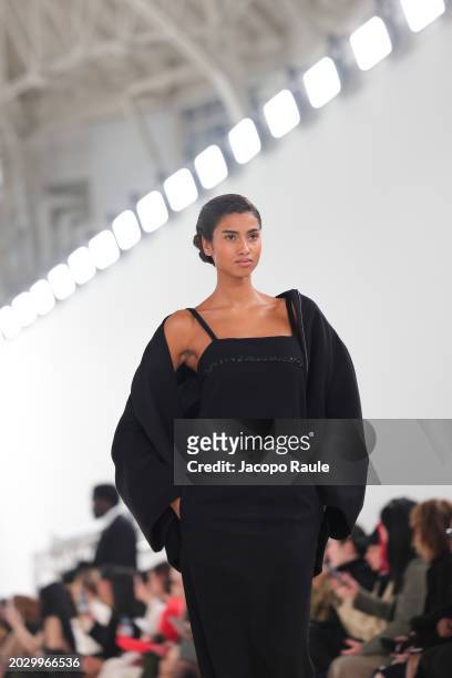 Imaan Hammam walks the runway at the Max Mara fashion show during the Milan Fashion Week Womenswear Fall/Winter 2024-2025 on February 22, 2024 in...