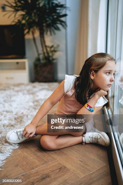 child girl with autism - sitting on ground stock pictures, royalty-free photos & images