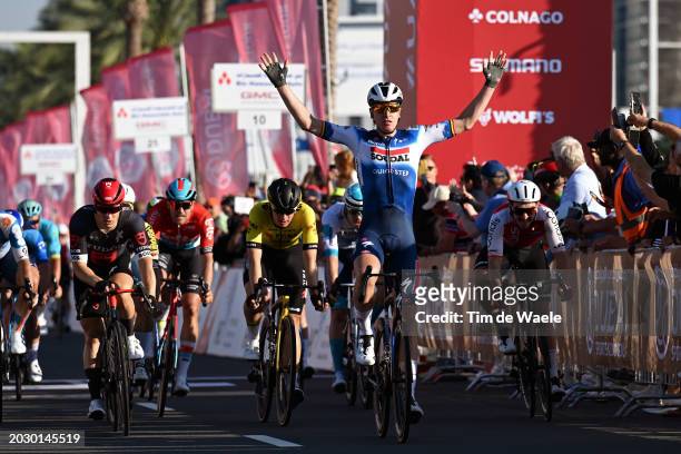 Tim Merlier of Belgium and Team Soudal-Quick Step celebrates at finish line as stage winner ahead of Arvid de Klein of The Netherlands and Team Tudor...