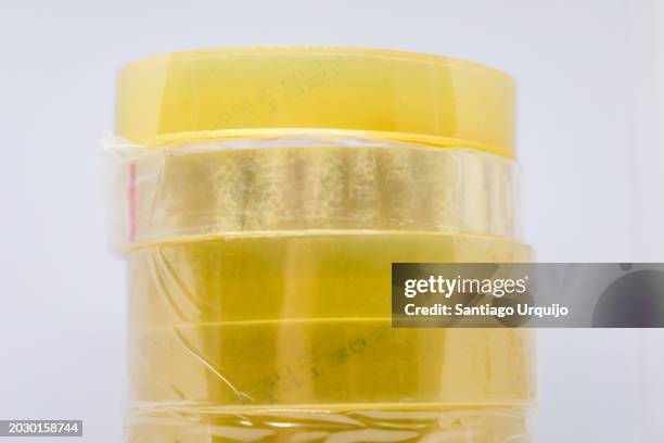 close-up of stack of scotch tape rolls - artículo de papelería fotografías e imágenes de stock