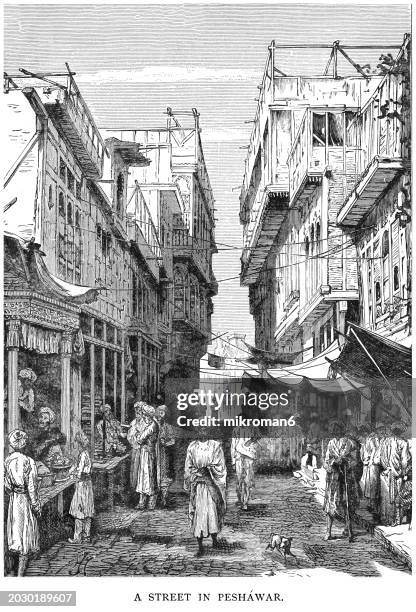 old engraved illustration of a street in peshawar, pakistan - peshawar stock pictures, royalty-free photos & images