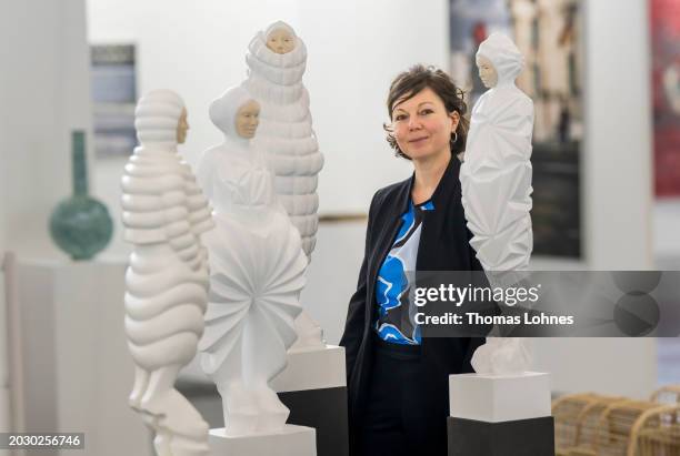 Artist Katharina Andress stands next to her sculptures 'Andreonaut' at art Karlsruhe on February 21, 2024 in Karlsruhe, Germany. At the 'art...