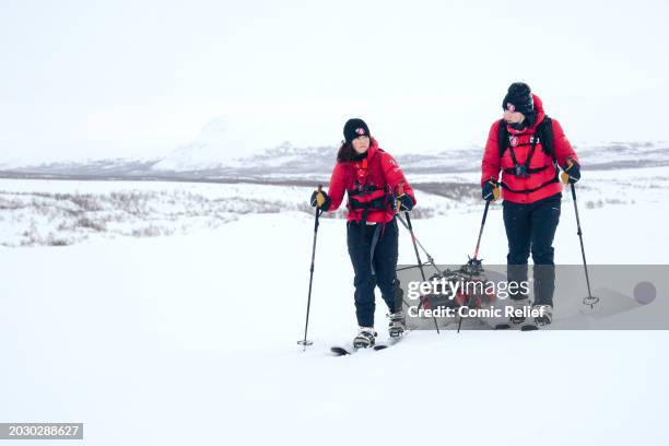 Vicky Pattison and Sara Davies during day three of the Snow Going Back Comic Relief 2024 Challenge walking through the Arctic landscape on the...